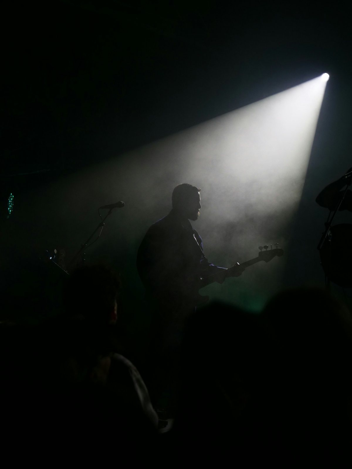 Musician under a stage light
